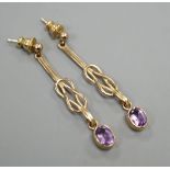 A modern pair of 9ct gold and amethyst set drop earrings, 4cm, gross 3.8 grams.