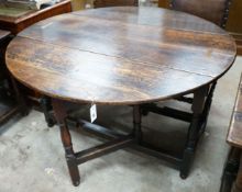 An 18th century oak gateleg table, 120cm extended, width 122cm, height 73cm