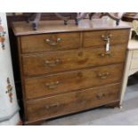 A George III provincial oak chest of two short and three long drawers, width 108cm, depth 52cm,