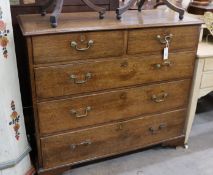 A George III provincial oak chest of two short and three long drawers, width 108cm, depth 52cm,