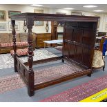 An 18th century style oak four poster bed with panelled canopy, width 162cm, length 221cm, height