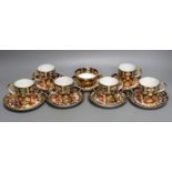 A Royal Crown Derby 6 set of coffee cans, 7 saucers and a similar Davenport cup and saucer (14)