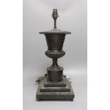 A bronze urn lamp on stepped serpentine base. Total height 49cm