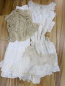 Five Victorian and Edwardian lace inserted camisole tops, a cream chemical lace jacket and a