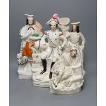 Four 19th century Staffordshire pottery groups - 40cm tall