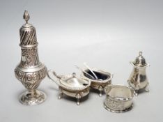 An Edwardian silver sugar sifter, Birmingham, 1901, a silver three piece condiment set and a