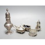 An Edwardian silver sugar sifter, Birmingham, 1901, a silver three piece condiment set and a