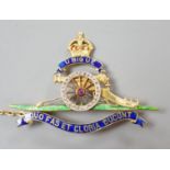 A 20th century yellow metal (stamped 18), enamel and diamond chip set Royal Artillery sweethearts