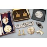 A white metal bracelet and minor jewellery and coins.