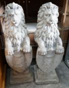 A pair of reconstituted stone heraldic lions, height 80cm