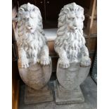 A pair of reconstituted stone heraldic lions, height 80cm