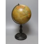 A Geographia 8 inch terrestrial globe, ebonised stand. 37cm tall
