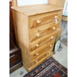 A small modern pine five door chest, width 69cm, depth 40cm, height 106cm
