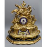 A 19th century gilt spelter mantel clock, having horse and jockey surmount with porcelain panels and