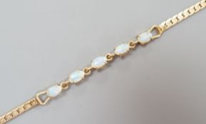 A modern gilt metal and five stone oval white opal set bracelet, 16.5cm.