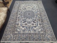 An ivory ground Nain carpet, 290 x 205cm