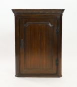 A George III oak hanging corner cupboard, width 75cm depth 43cm height 99cm