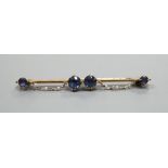 An early 20th century yellow metal sapphire and seed pearl set bar brooch, 61mm, gross weight 5.6