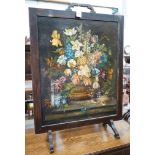 An early 20th century painted fire screen inset still life oil on canvas, width 66cm, height 94cm