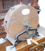 A Victorian cast iron mounted mahogany knife polisher, height 44cm