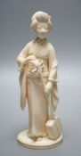 A Japanese Meiji period okimono of a lady with a musical instrument,19 cms high.