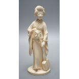 A Japanese Meiji period okimono of a lady with a musical instrument,19 cms high.