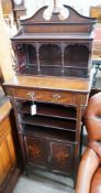 An Edwardian marquetry inlaid mahogany side cabinet, with galleried top, open shelves and a pair