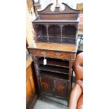 An Edwardian marquetry inlaid mahogany side cabinet, with galleried top, open shelves and a pair