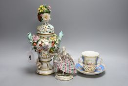 A Dresden floral encrusted pot pourri vase and cover, 29cm tall, a figure of a lady and a Dresden