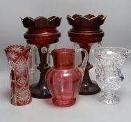 A pair of late 19th century ruby glass lustres, 30cm tall, cranberry jug, Bohemian vase and one