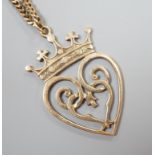 A 1970's Scottish 9ct gold Iona heart shaped pendant, 46mm, on a 9ct gold chain, 74cm,27.6 grams.