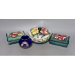 A pair of Moorcroft boxes with covers, together two other moorcroft pots (4)