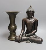 A Chinese bronze vase, 26cm high, inscription to base, together with a bronzed composition seated