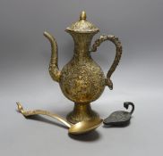 A cast Eastern ewer, 26.5cm tall, together with a miniature cast iron oil lamp and a server spoon (