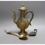 A cast Eastern ewer, 26.5cm tall, together with a miniature cast iron oil lamp and a server spoon (