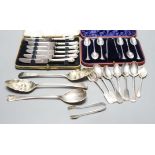 Two George III silver 'berry' spoons, seven other silver spoons, pair of silver tongs, a Swedish