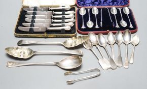 Two George III silver 'berry' spoons, seven other silver spoons, pair of silver tongs, a Swedish