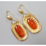 A pair of yellow metal and orange agate set oval drop earrings, overall 46mm, gross 6.8 grams.