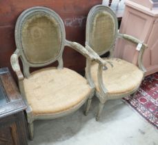 A pair of Louis XVI style painted fauteuils, width 59cm, depth 50cm, height 92cm
