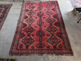 A Caucasian style red ground rug, 255 x 167cm