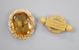 Two Victorian yellow metal brooches, one set with large oval citrine, largest 36mm, gross 19.2