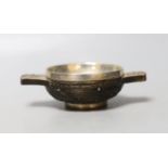A late 18th/early 19th century white metal mounted wooded quaich, with interwoven carving, unmarked,