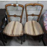 A pair of Aesthetic movement dining chairs