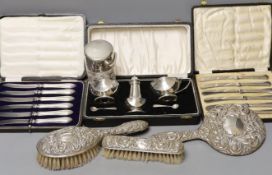 A cased 1950's silver three piece condiment set, two cased sets of six silver handled tea knives,