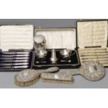 A cased 1950's silver three piece condiment set, two cased sets of six silver handled tea knives,