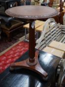 A Gillows style circular mahogany wine table, diameter 50cm height 71cm