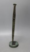 A Lurestan bronze dagger, on stand,34.5 cms high.