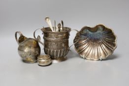 A George II silver porringer, London, 1748, 10.9cm, a George III silver cream jug, a silver shell