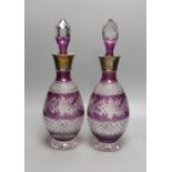 A pair of Bohemian silver mounted cut and amethyst flashed glass decanters and stoppers, 33cm