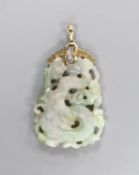 A Chinese jadeite Dragon pendant, the yellow metal mount stamped 14 K and set with diamond chips,